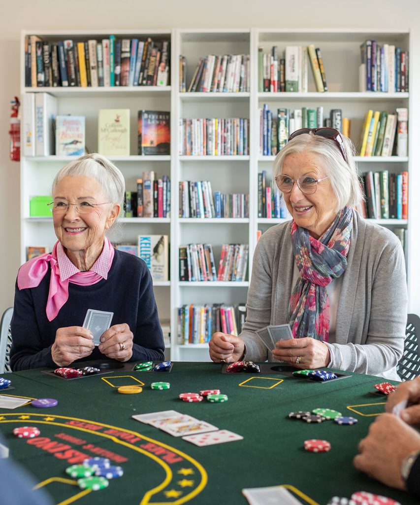 Residents playing a few games of poker in the library
